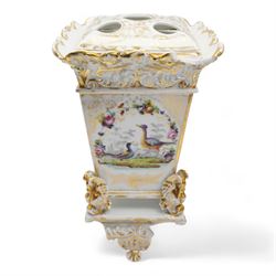 Pair of 19th century French porcelain jardinieres, in the style of Jacob Petit, each of square form, the body painted with panels of exotic birds and sprays of flowers, below a scroll and gilt moulded border, raised upon four swan feet and scroll base, unmarked, H34cm x W20cm