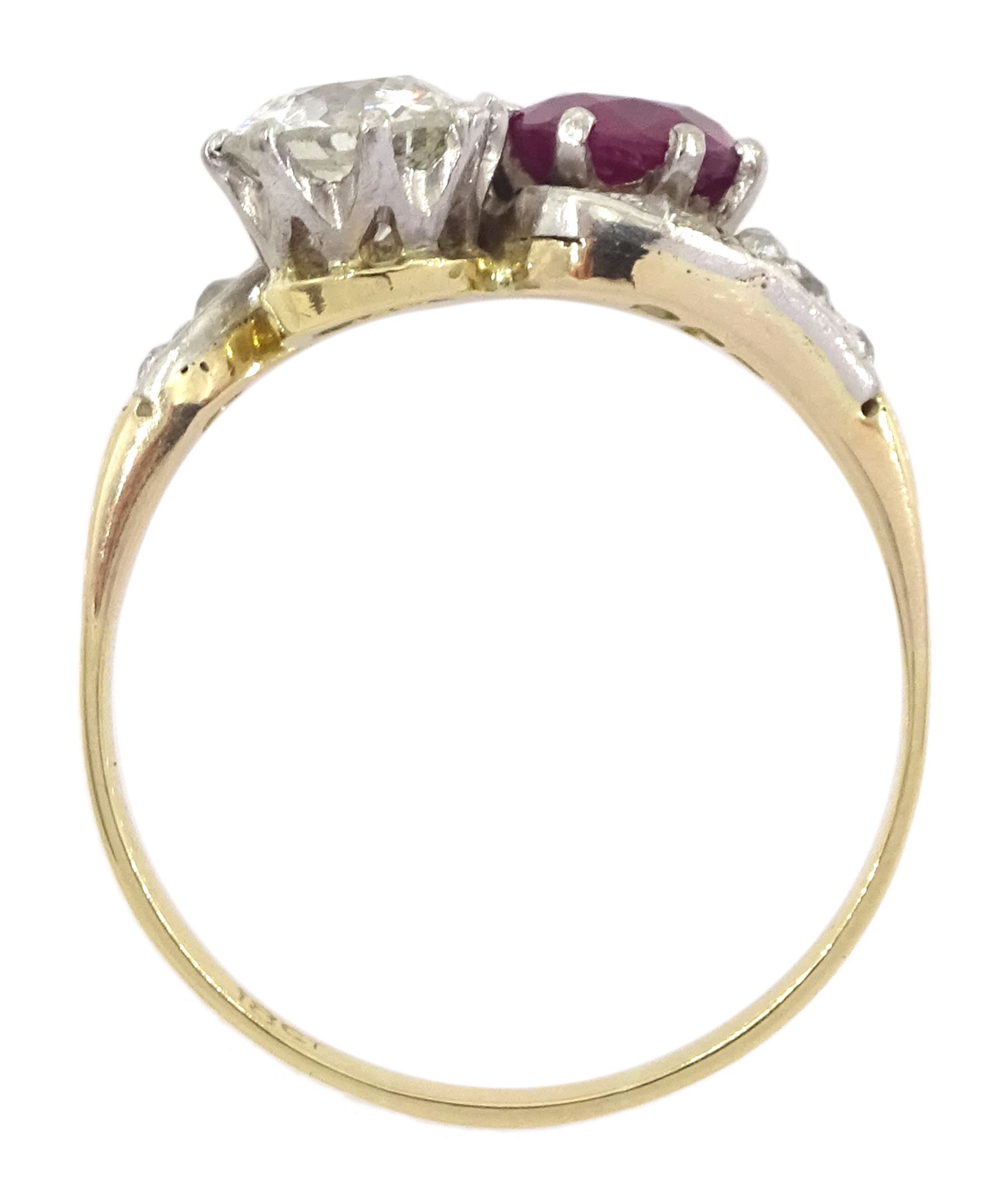 Early 20th century gold old cut diamond and ruby crossover ring, with diamond set shoulders, stamped 18ct, diamond approx 0.70 carat, ruby approx 0.75 carat