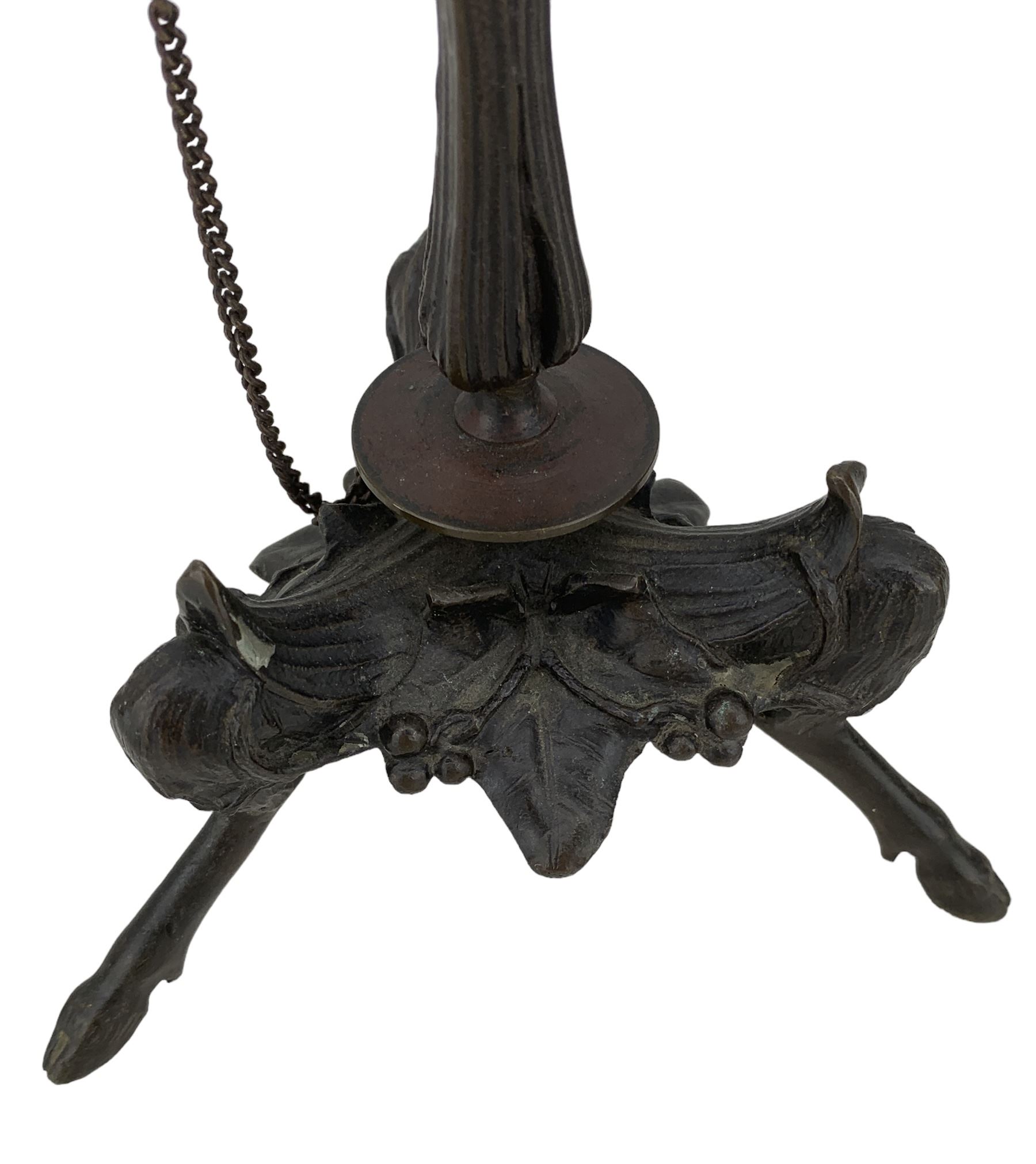 Pair of 19th century French patinated bronze candlesticks in the manner of Ferdinand Barbedienne, the gadrooned sconces hung with chains, reeded columns on tripod supports with hoof feet, H28cm 