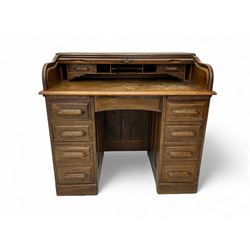 Early 20th century ok twin pedestal roll top desk, the tambour roll enclosing small drawer...