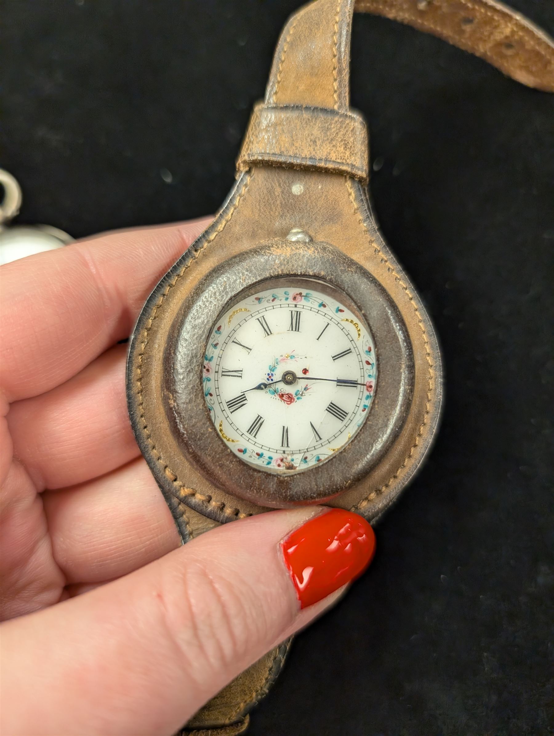 Two continental silver fob watches with enamel dials, one stamped 800, one stamped 935 and in leather wriststrap