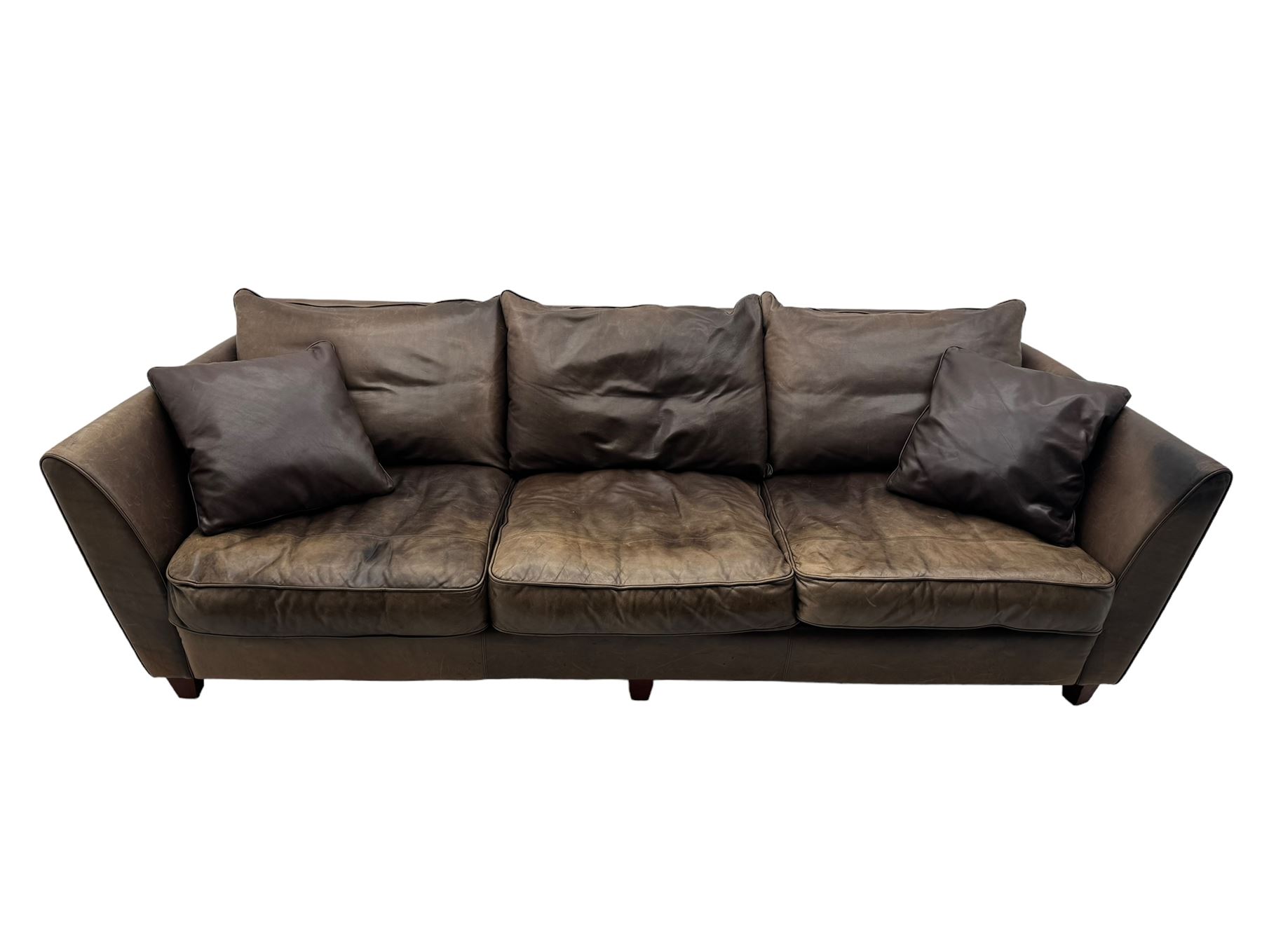 Collins & Hayes - contemporary grande three-seater sofa upholstered in brown leather, with curved arms and standing on tapering feet