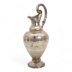 Victorian silver claret jug of baluster form engraved with Greek dithyramb panels in honour of  Dionysus, the spout with the mask of Pan, the scroll handle with birds foot terminal and with further engraved guilloche and other decoration H36cm Sheffield 1864 Maker Roberts & Belk 