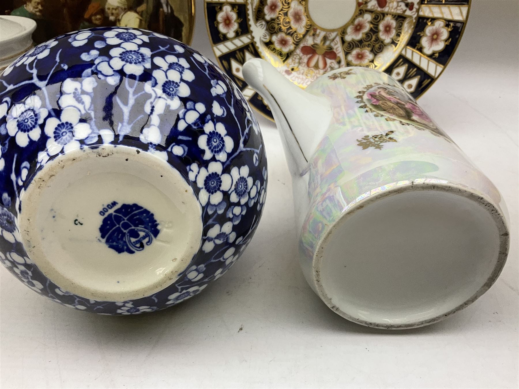 Quantity of ceramics to include Royal Crown Derby Imari plate, no. 2451, Sastuma vase, Frederick Rhead blue and white Prunus vase for Wood and Sons, Dresden pierced basket bowl with encrusted flowers and twin handles, James Kent Old Foley lidded jar with floral decoration, etc