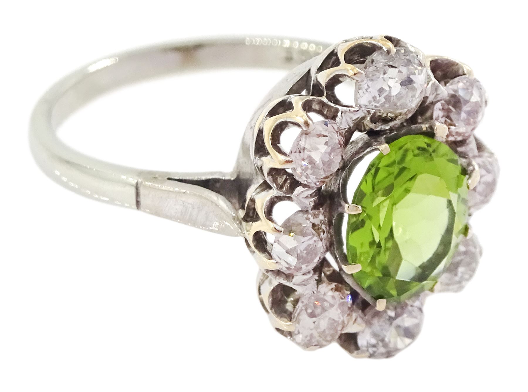 18ct white gold oval cut peridot and old cut diamond cluster ring, stamped 18ct, total diamond weight approx 1.20 carat