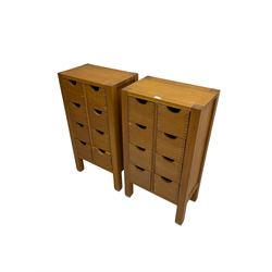 Pair oak CD cabinets, fitted with eight drawers and panelled sides