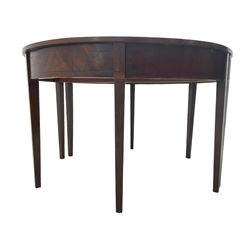 Regency mahogany D-ended extending dining table, circular top with banded fireze inlaid with ebony stringing, raised on square tapering supports, with two additional leaves, supported by gate-leg central action