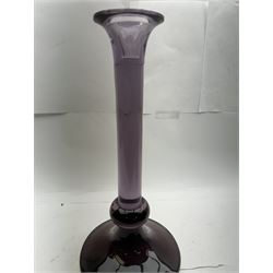 Large heavy gauge Scandinavian amethyst glass candlestick, the plain column with flared rim and basel knop, upon a spreading circular base, H44cm