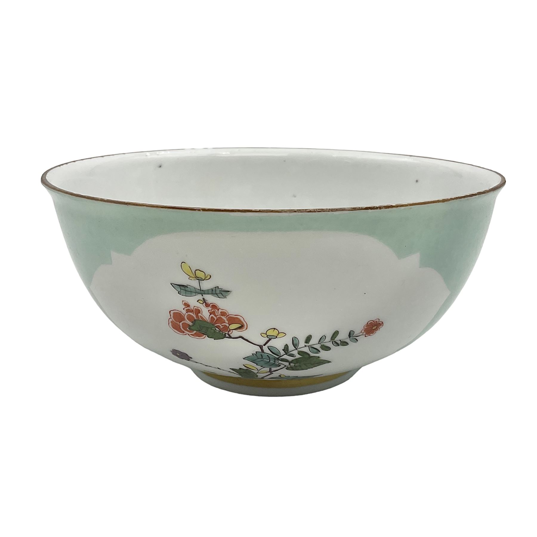 18th century Meissen turquoise ground bowl, circa 1740, decorated with two shaped reserves painted with Kakiemon type flowers, with gilt rim and band to short circular foot, with undergaze blue crossed swords mark to base, H7cm D15.5cm