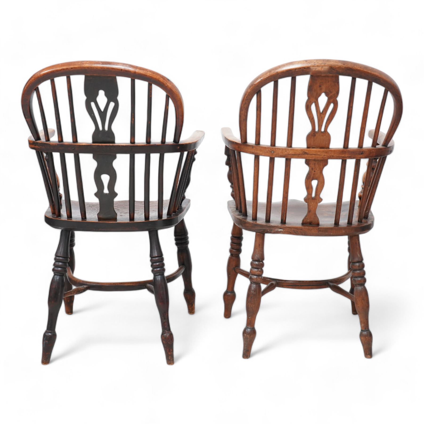 Near pair of 19th century elm and ash Windsor armchairs, each with double hoop and stick back with shaped and pierced splat, dished seat on turned supports united by crinoline stretcher 