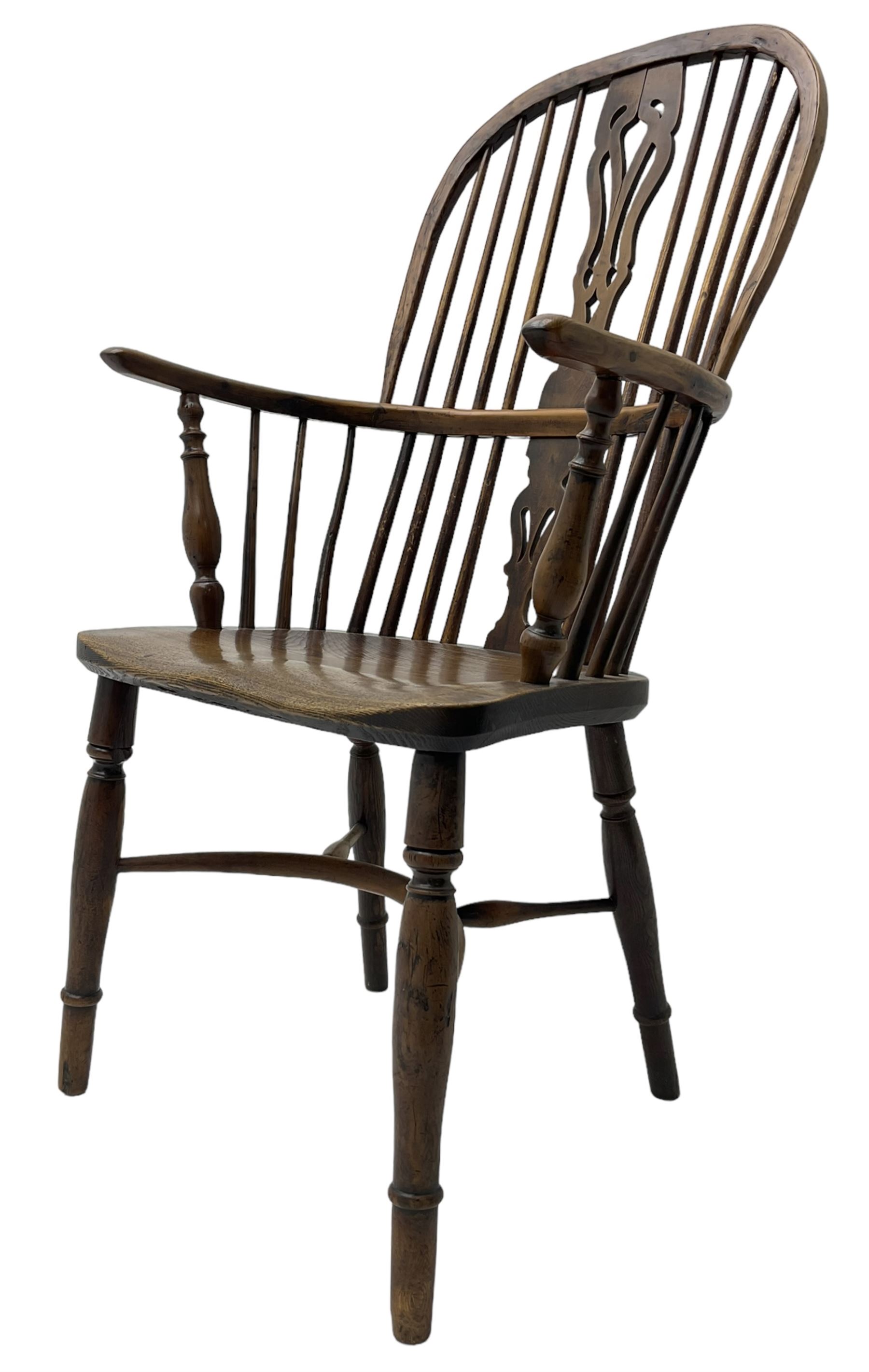 19th century yew wood and elm Windsor chair, high hoop and stick back with pierced splat over dished seat, raised on ring turned supports united by crinoline stretcher