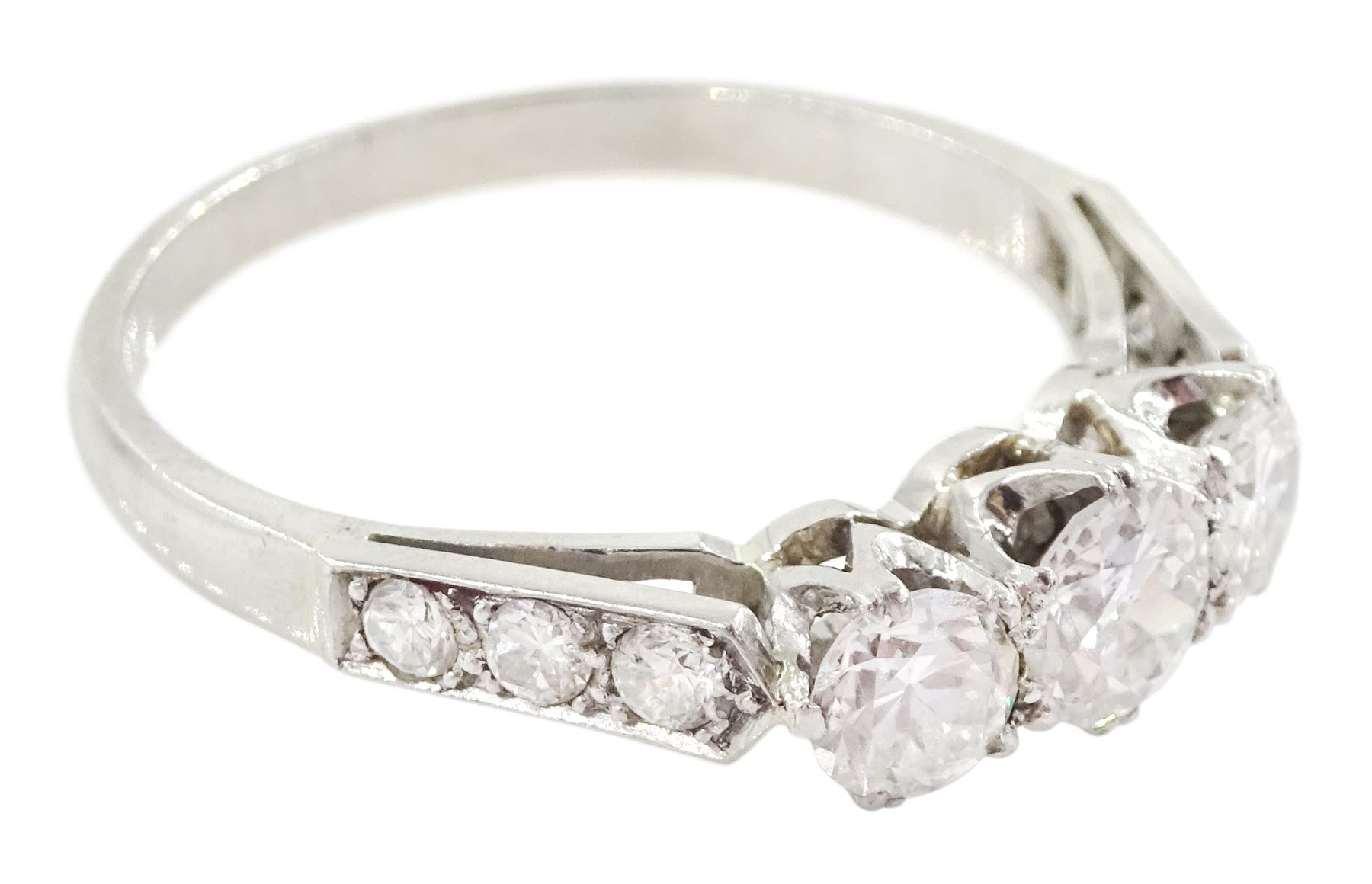 Early 20th century platinum three stone old cut diamond ring, with diamond set shoulders, total diamond weight approx 1.20 carat