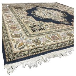 Persian Kirman indigo ground rug, central floral design medallion with matching spandrels, the guarded border decorated with stylised plant motifs 