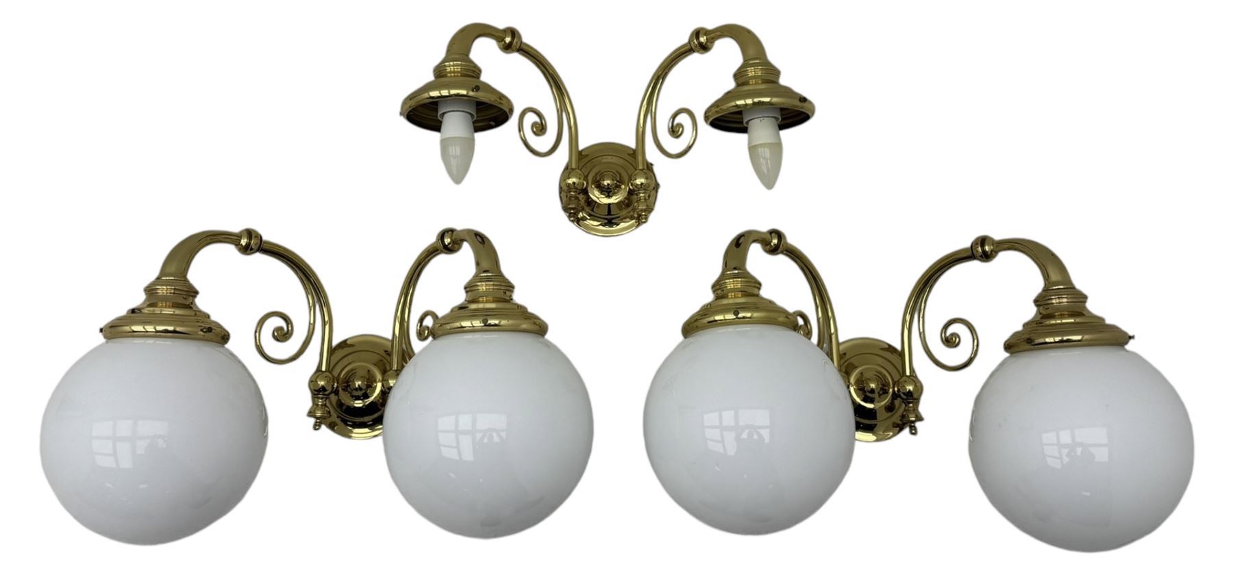 Two brass double-arm wall mounted lights, each with frosted glass globes and scrolled arms (W50cm, D26cm, H31cm); matching central double-arm light with candle-style fittings (W42cm, D24cm, H22cm)