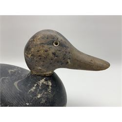 Early 20th century American carved wooden decoy duck, with weight beneath marked CJ Raymond Lead Co Chicago, Ill, H18cm, L38cm 