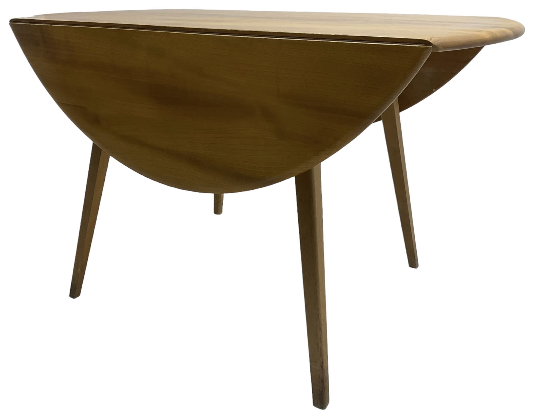 Ercol - mid-20th century golden elm drop-leaf dining table, circular top over splayed supports