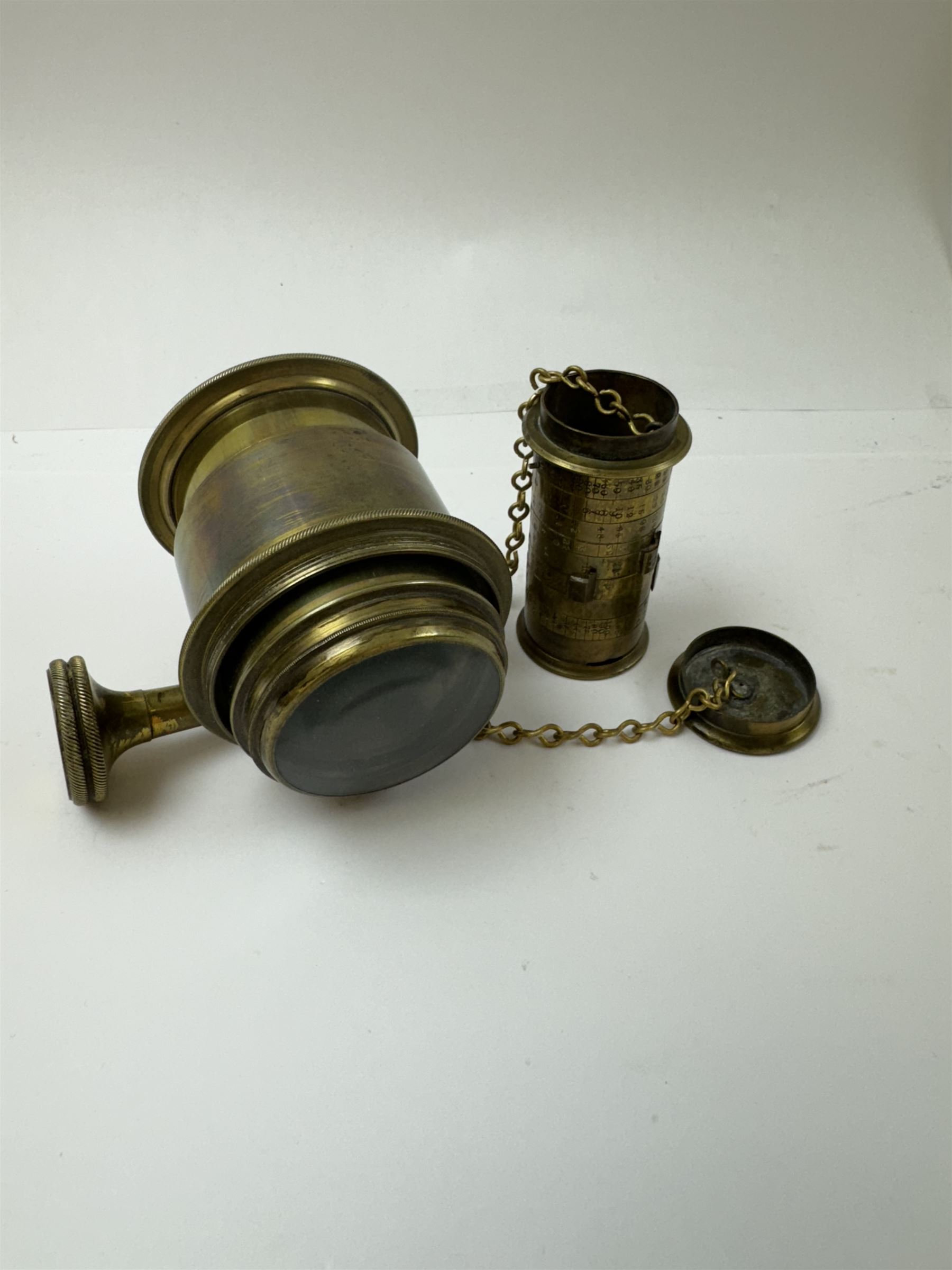 Late 19th century Watkins Exposure Meter, in cylindrical brass case, inscribed Sole Makers R. Field & Co, Birmingham, together with a 19th century brass plate camera lens