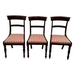 Set of six Victorian mahogany dining chairs, curved bar back over drop-in seat upholstered in striped fabric, on turned front supports