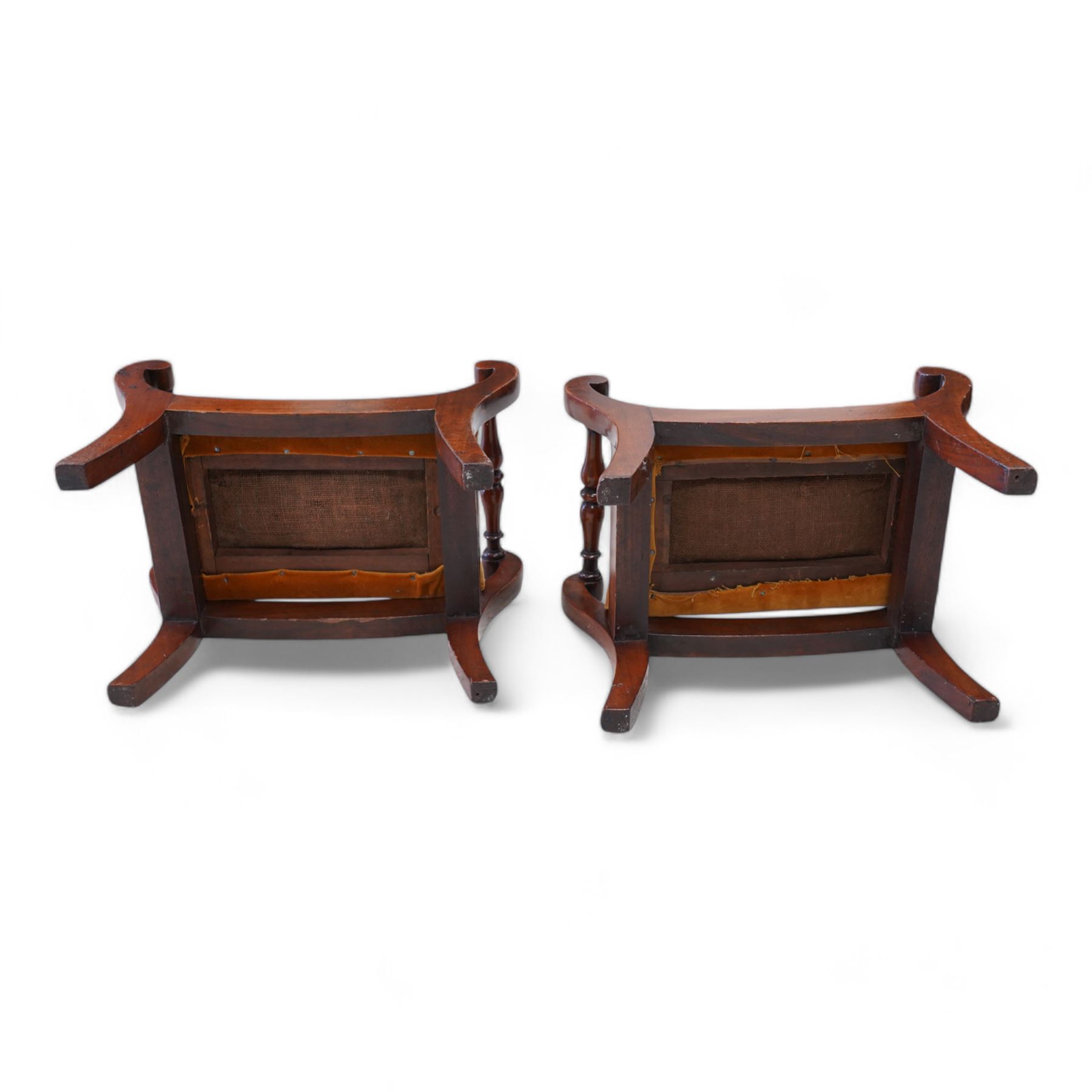 Pair of early to mid-19th century footstools, scroll uprights terminating to splayed feet, united by turned stretchers, drop-in seats upholstered in mustard fabric 