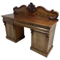 Victorian mahogany twin pedestal chiffonier, raised back with decorated with scrolling foliate motifs, fitted with three cushion drawers, the arched panelled pedestals enclosing shelves and sliding trays