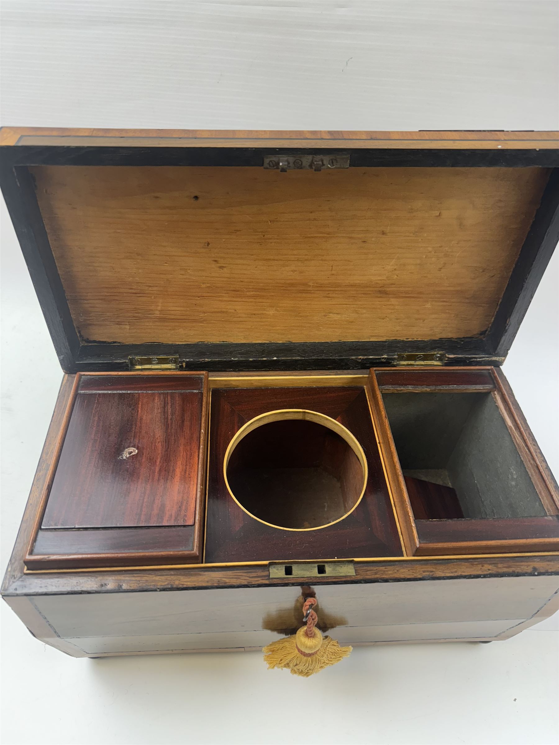 Georgian sarcophogus shaped tea caddy, with inlaid panels and twin lion mask handles, with mahogany compartmentalised interior, upon four bun feet, H22cm