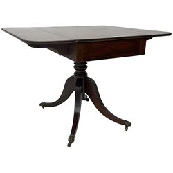 Early 19th century mahogany supper table, rectangular reed moulded drop-leaf top with rounded corners, fitted with single end drawer, on turned pedestal with four out-splayed supports with brass paw castors 