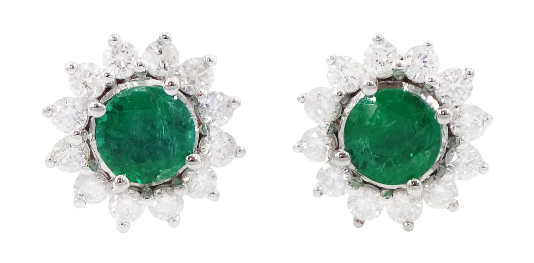 Pair of 18ct white gold emerald and round brilliant cut diamond cluster stud earrings, stamped, total emerald weight approx 0.90 carat, total diamond weight approx 0.65 carat