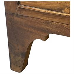 Early 19th century mahogany bow-front chest, mahogany banded top over four long graduating cock-beaded drawers, oval pressed brass plate handles, on shaped apron with bracket feet