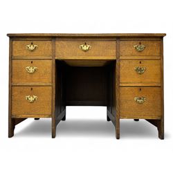 Edwardian oak twin pedestal desk, moulded rectangular top with inset writing surface, fitt...