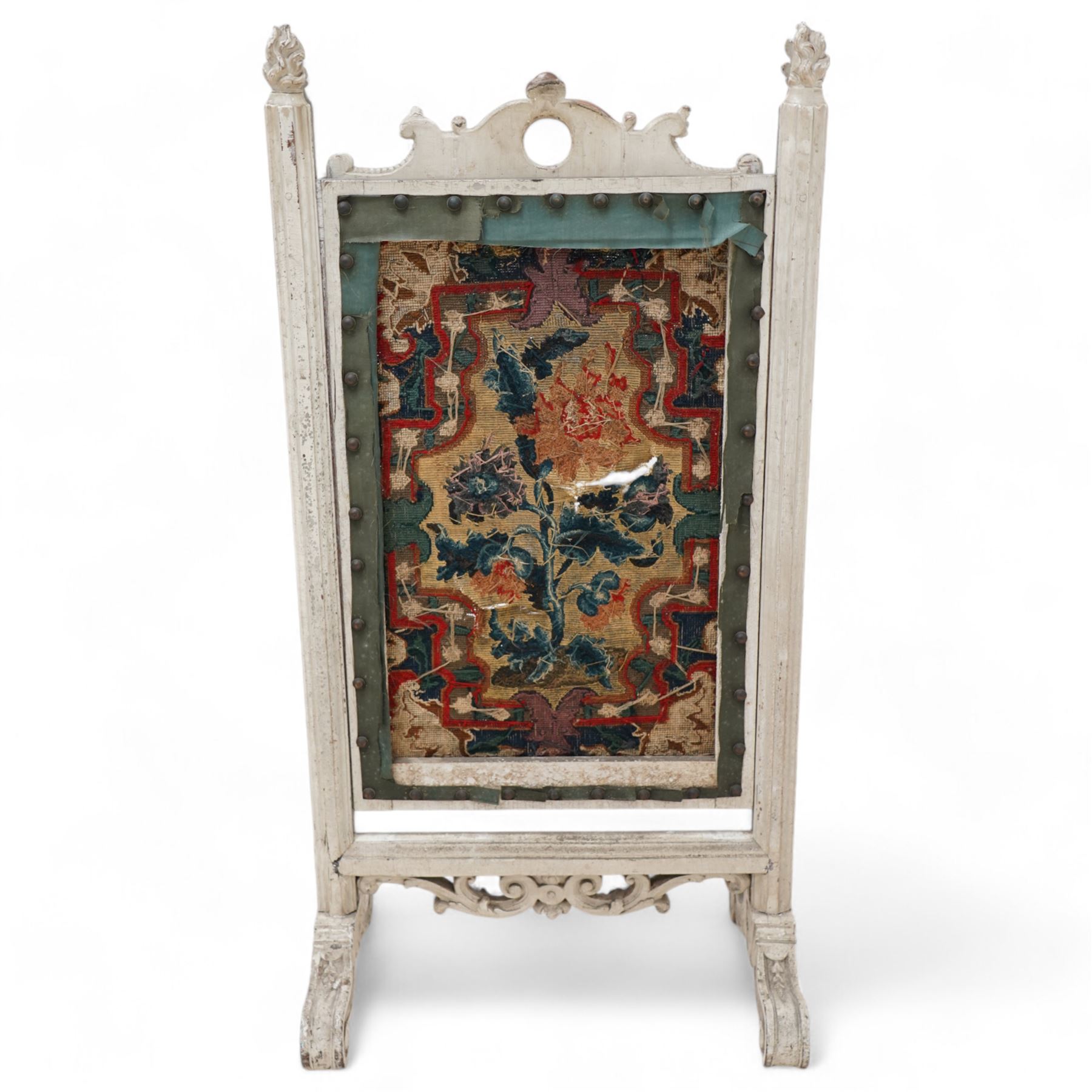 19th century carved wood fire screen, with lift-up tapestry panel, pierced pediment carved with C-scrolls and curled leaves, flanked by moulded uprights with torch finials, on scrolled out splayed feet 