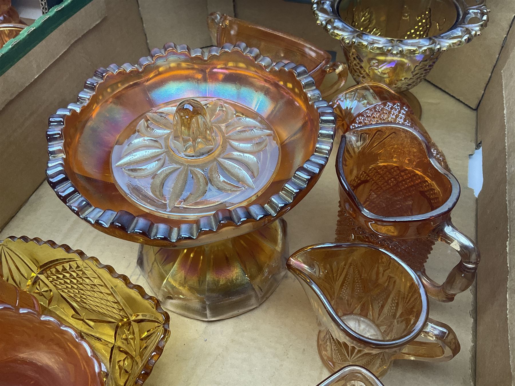 Collection of orange carnival glass, including jugs, dishes, vases etc, in two boxes 