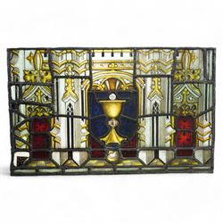 19th century leaded glass religious panel with a central chalice and various symbols 38cm x 61cm