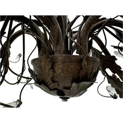 India Jane Interiors - contemporary wrought iron chandelier, adorned with vine and leaf motifs intertwined with faceted glass crystal drops, curved arms supporting six candle-style light fittings, the central stem terminating in a suspension loop