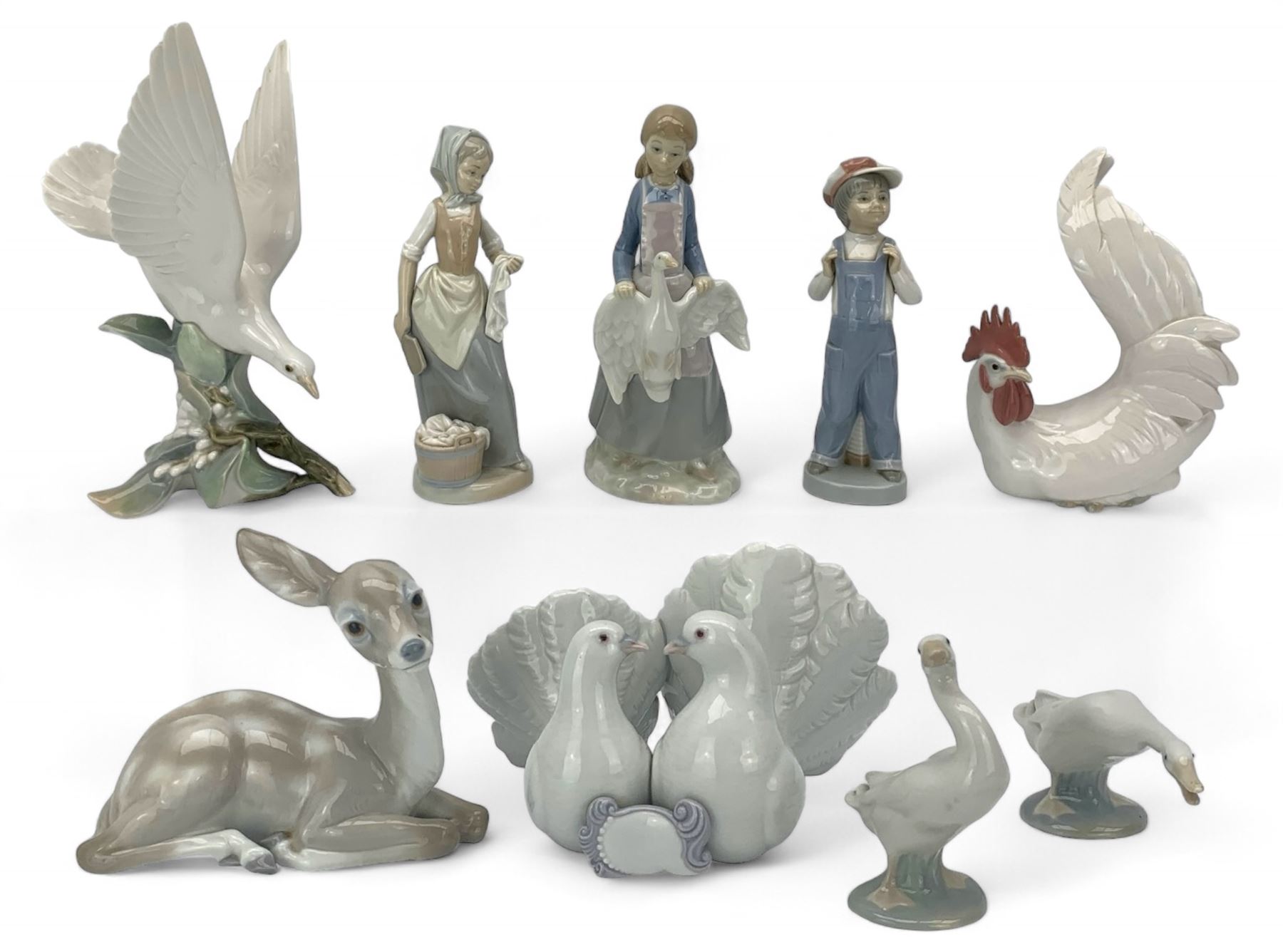 Seven Lladro figures including group of two doves, rooster, boy with accordion, deer, dove in flight , two geese and two Nao figures