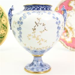 Early 20th century Royal Crown Derby porcelain twin handled vase, circa 1926, the central cartouche with a landscape, H16cm, Coalport cabinet plate centrally painted with a Red Grouse in a Highland landscape, within a green and gilt raised border, D22cm, together with a Coalport dish, hand painted with fruit against a pink and gilt ground (3)