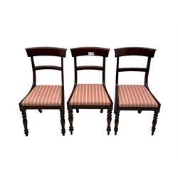 Set of six Victorian mahogany dining chairs, curved bar back over drop-in seat upholstered in striped fabric, on turned front supports