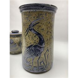 John Egerton (c1945-): studio pottery stoneware, comprising wine cooler decorated with herons on a mottled ground, covered storage jar with foliage decoration and a lamp base decorated with grape vines, wine cooler H23cm