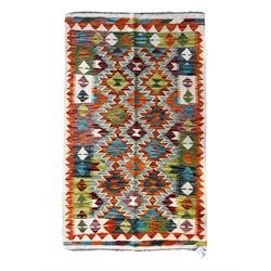 Chobi Kilim ivory ground rug, the busy multi-coloured field decorated with two concentric ...