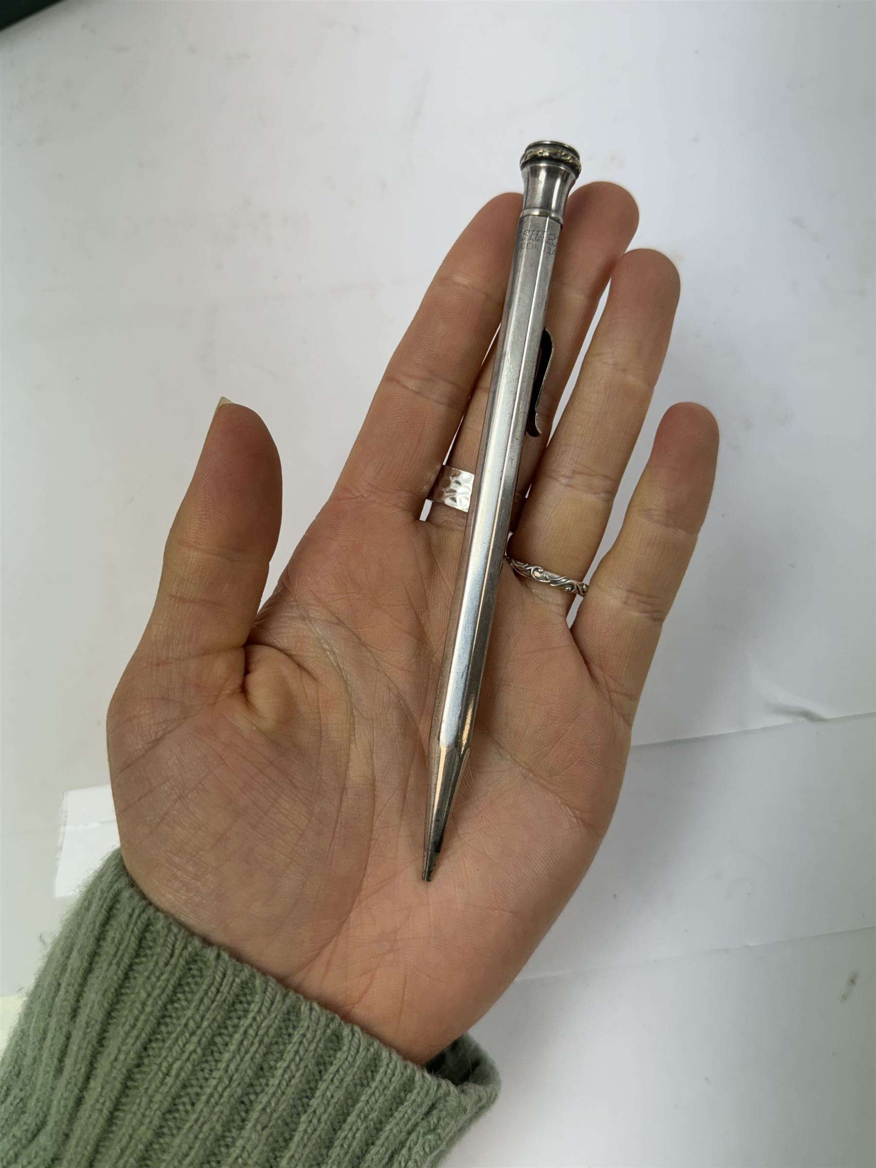 Five mechanical pencils including silver plated examples, together with a collagraphy pen with silver collar