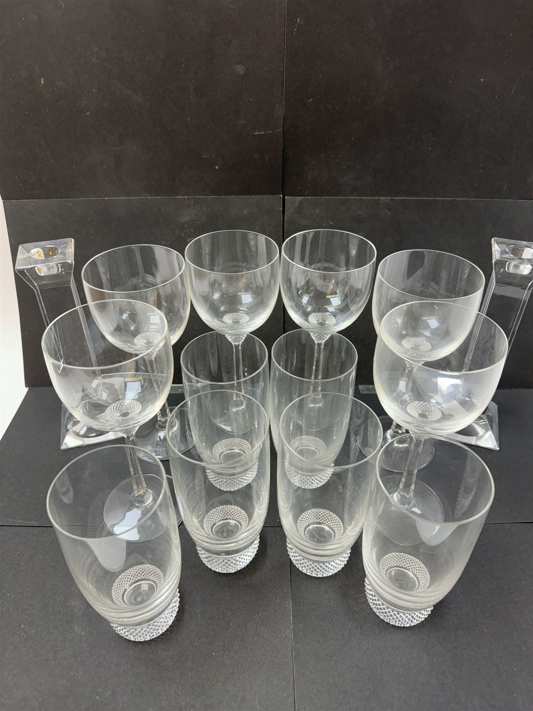 Twelve Villeroy & Boch Octavie glasses, to include six red wine glasses and six tumblers, each glass with hobnail cut decoration, together with a pair of Villeroy & Boch faceted glass candlesticks