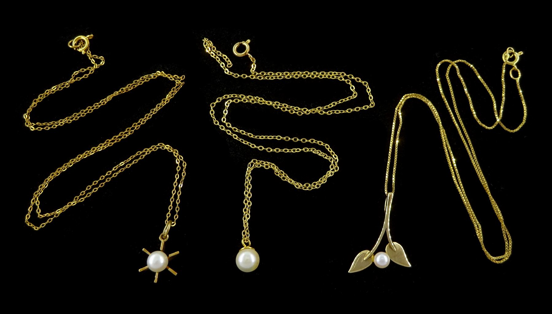 Three 9ct gold pearl pendant necklaces