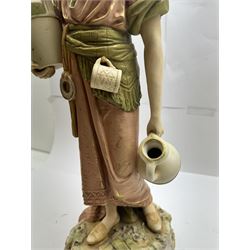 Royal Dux figure no. 686, modelled as a female water carrier, carrying two urns and wearing flowing green and pink robes, with applied pink triangle mark beneath, H61cm