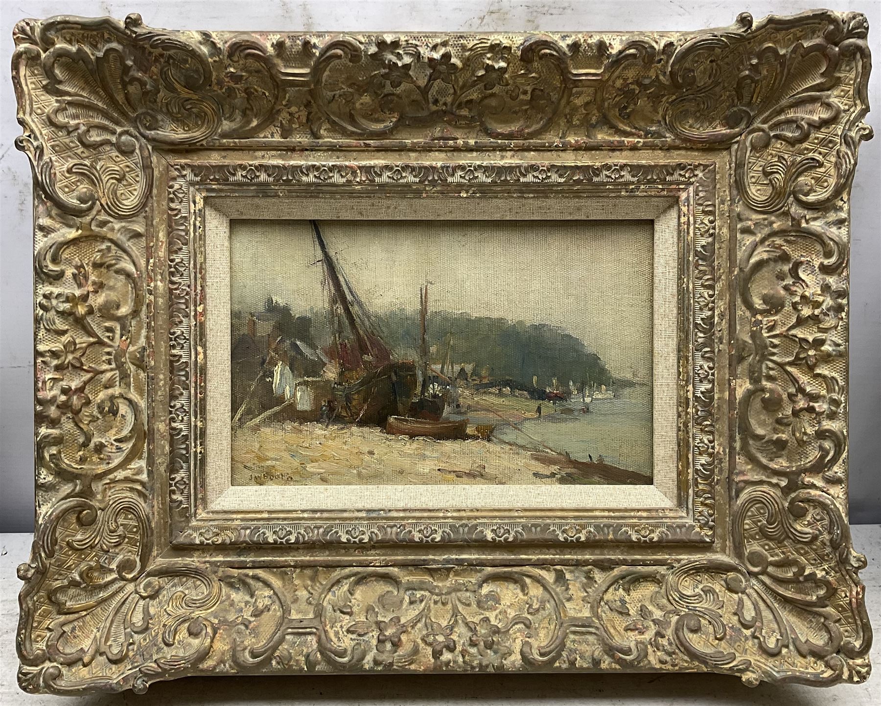 James William Booth (Staithes Group 1867-1953): Boats on the Riverside, oil on canvas laid on to board signed 15cm x 24cm