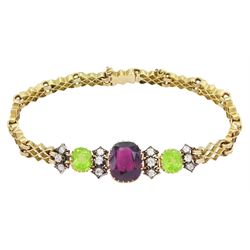 Early 20th century 15ct gold garnet, peridot and diamond, fancy link chain bracelet, the central cushion cut rhodolite garnet of approx 5.05 carat, with two cushion cut peridots set either side, spaced by three old cut diamonds, total diamond weight approx 0.35 carat, in fitted case by Garrard & Co