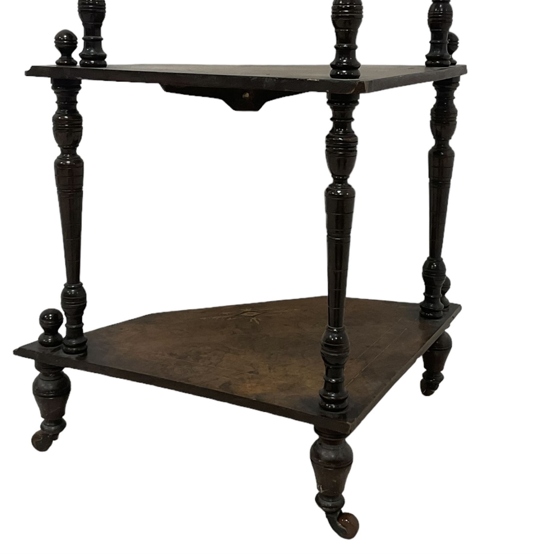 Victorian inlaid walnut corner four-tier whatnot, raised back over four graduating tiers of triangular form, decorated with satinwood and ebony inlays, united by tapering ring turned uprights, on castors