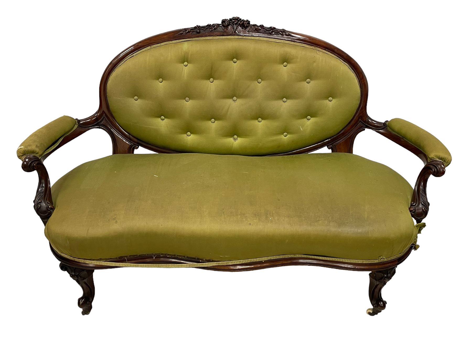 Victorian carved walnut framed two seat settee, cresting rail carved and moulded with a posy of roses and trailing foliate, over an oval back with scrolled arm terminals, serpentine fronted seat over cabriole supports with bell-flower carved knees, buttoned back and sprung seat upholstered in olive green fabric