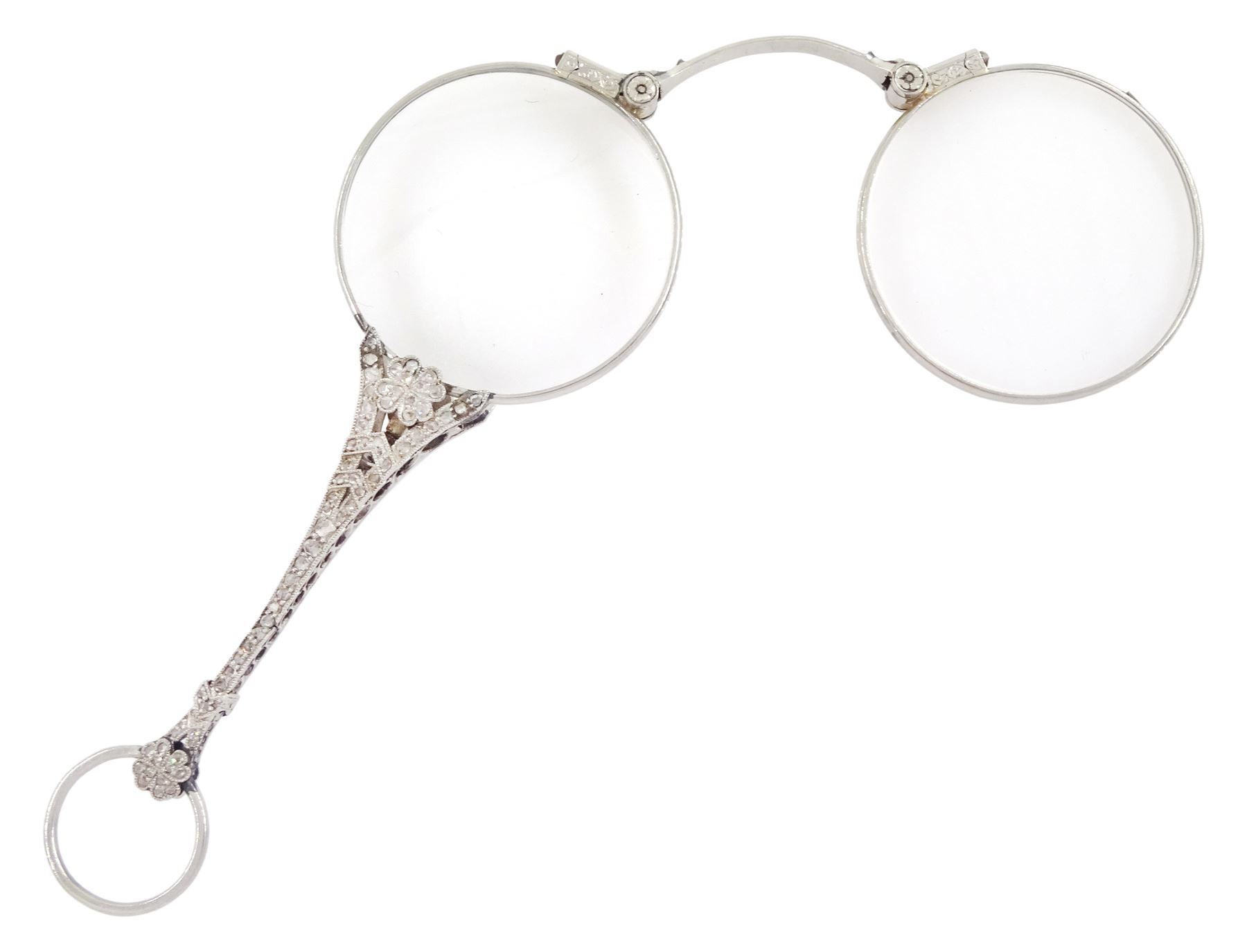 Early 20th century platinum and diamond lorgnette, the milgrain set rose cut diamond handle, with flower head terminals, the reverse with engraved foliate decoration, to spring-loaded glass lenses