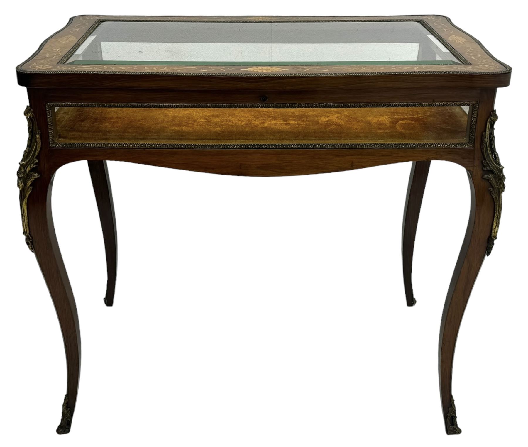 Victorian inlaid rosewood bijouterie table cabinet, shaped form, enclosed by hinged bevel glazed lid with shell and floral inlays, fabric lined interior, glazed sides within foliate cast gilt metal edging, on cabriole supports with floral cast gilt metal mounts and terminal caps 