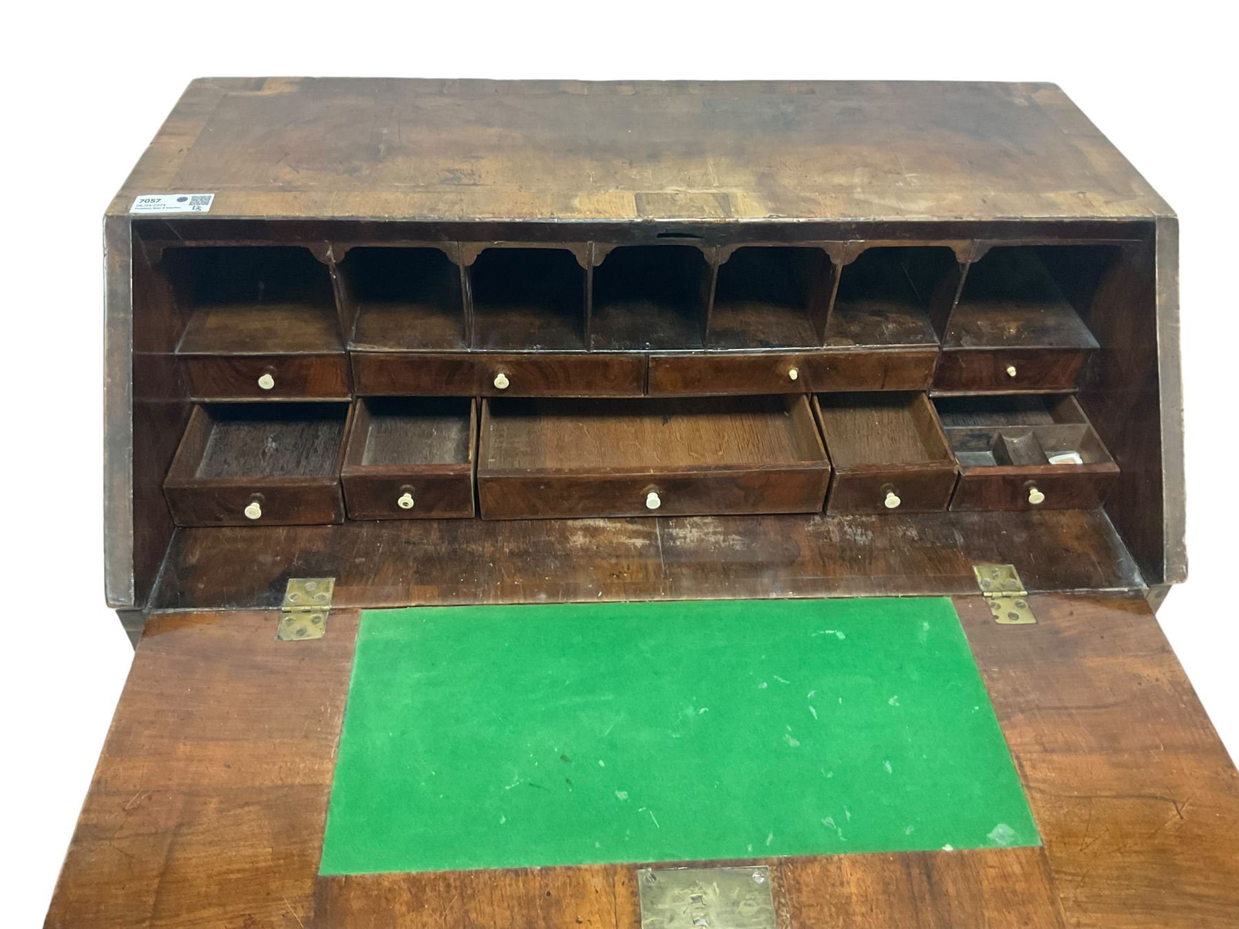 18th century walnut bureau, crossbanded and feather-banded rectangular top and fall-front, enclosing fitted interior with pigeonholes and correspondence drawers with bone handles, over two short and three long graduating drawers with moulded facias and original brass handles, on bracket feet