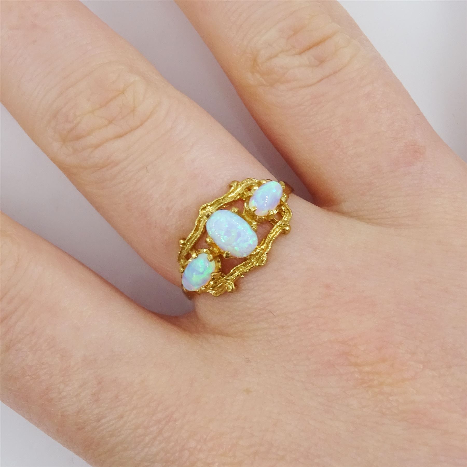 Silver-gilt three stone opal ring, stamped